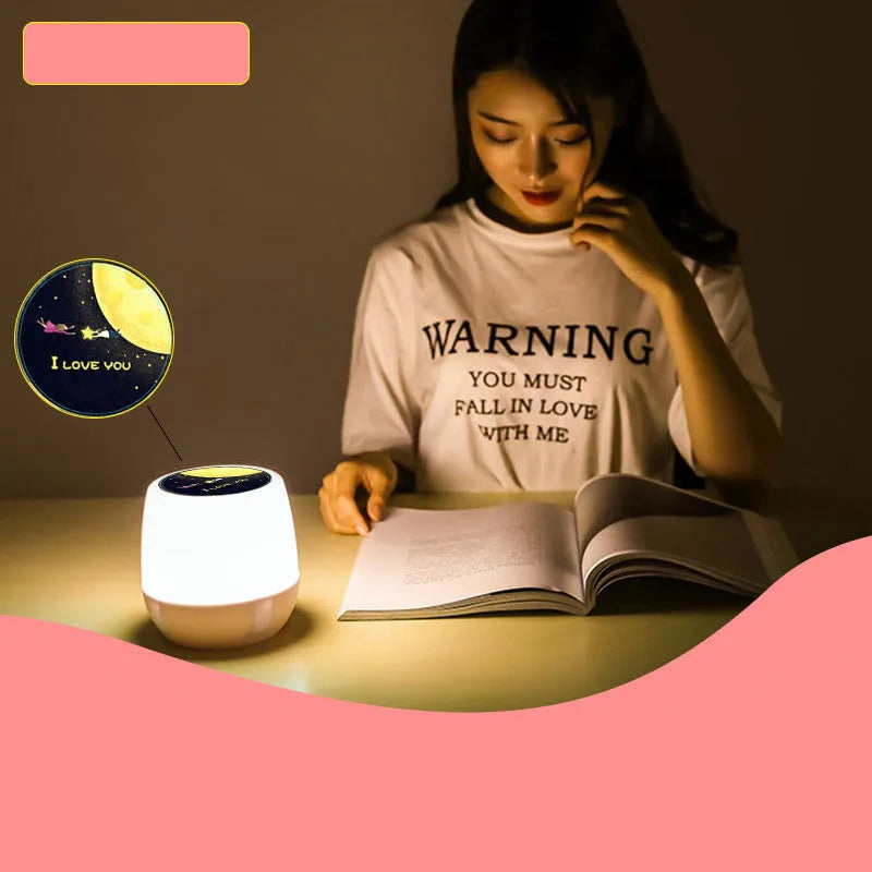 Pruixin rotating LED projector night light displaying star patterns on a bedroom ceiling.
