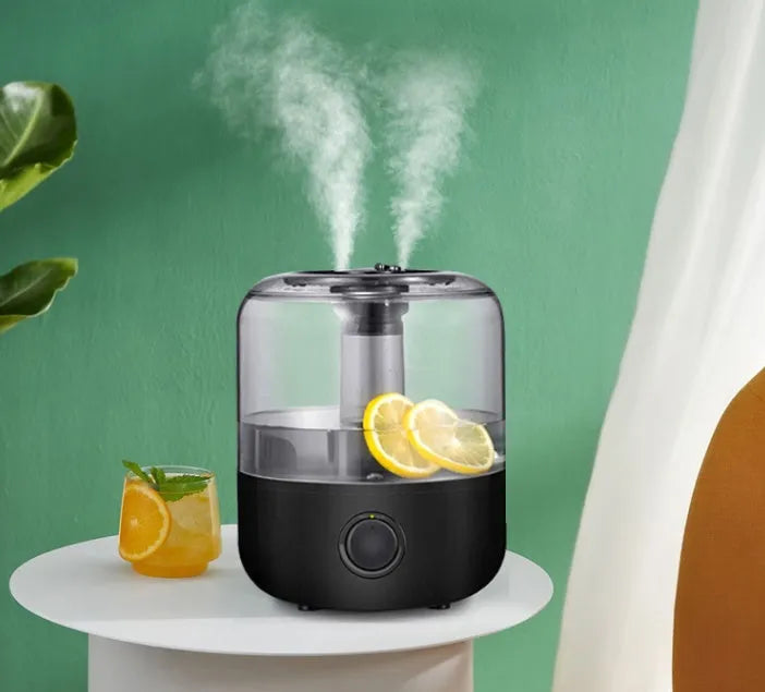 Black and white ultrasonic cool mist humidifier with 3-litre tank and mechanical controls.