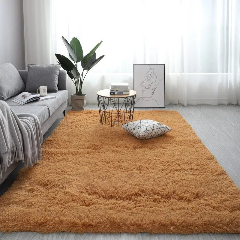 Rectangle fluffy plush carpet rug with anti-slip backing in a light colour on a wooden floor