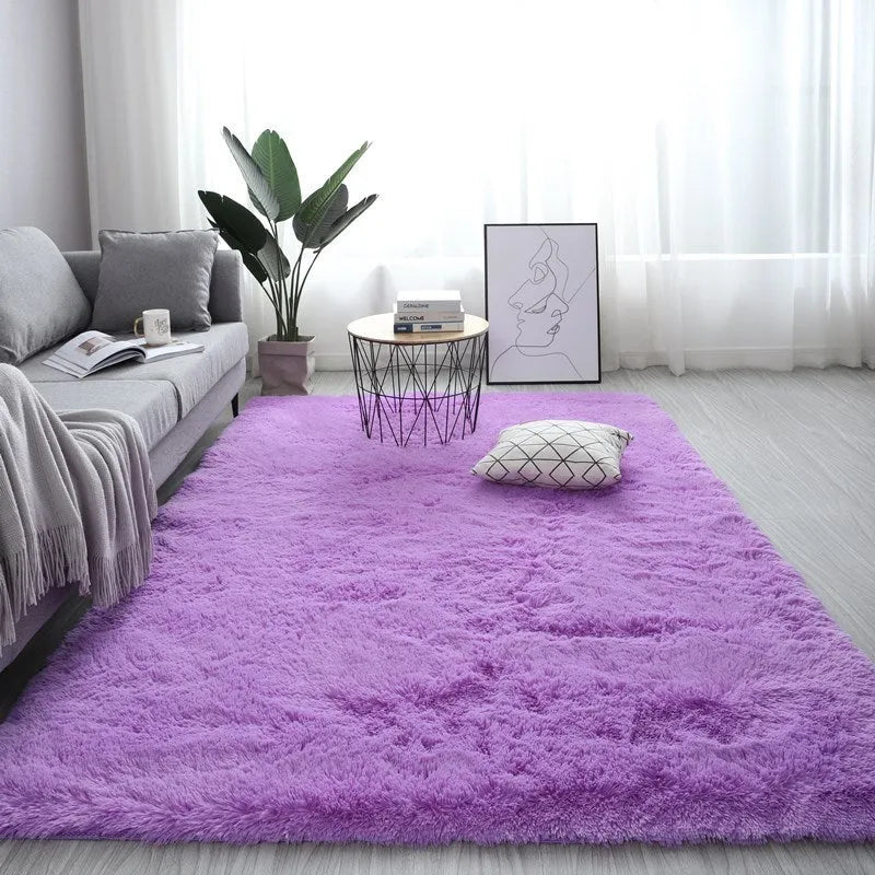 Rectangle fluffy plush carpet rug with anti-slip backing in a light colour on a wooden floor