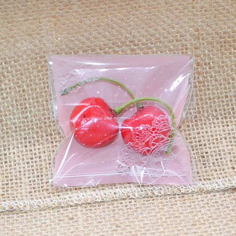 Pink self-adhesive plastic packaging bags with UV printing measuring 7x7cm for handmade soap packaging