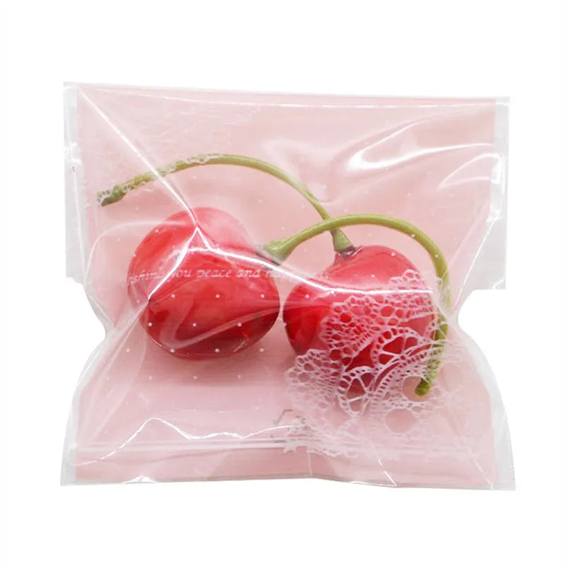 Pink self-adhesive plastic packaging bags with UV printing measuring 7x7cm for handmade soap packaging