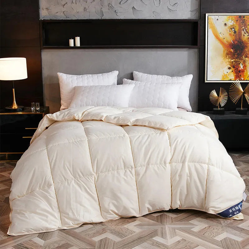 Goose down winter duvet with twill weave fabric in blue grey colour on bed