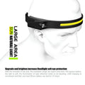 Black silicone induction running light with strap, showing touch sensor and compact 55x35x100mm size.