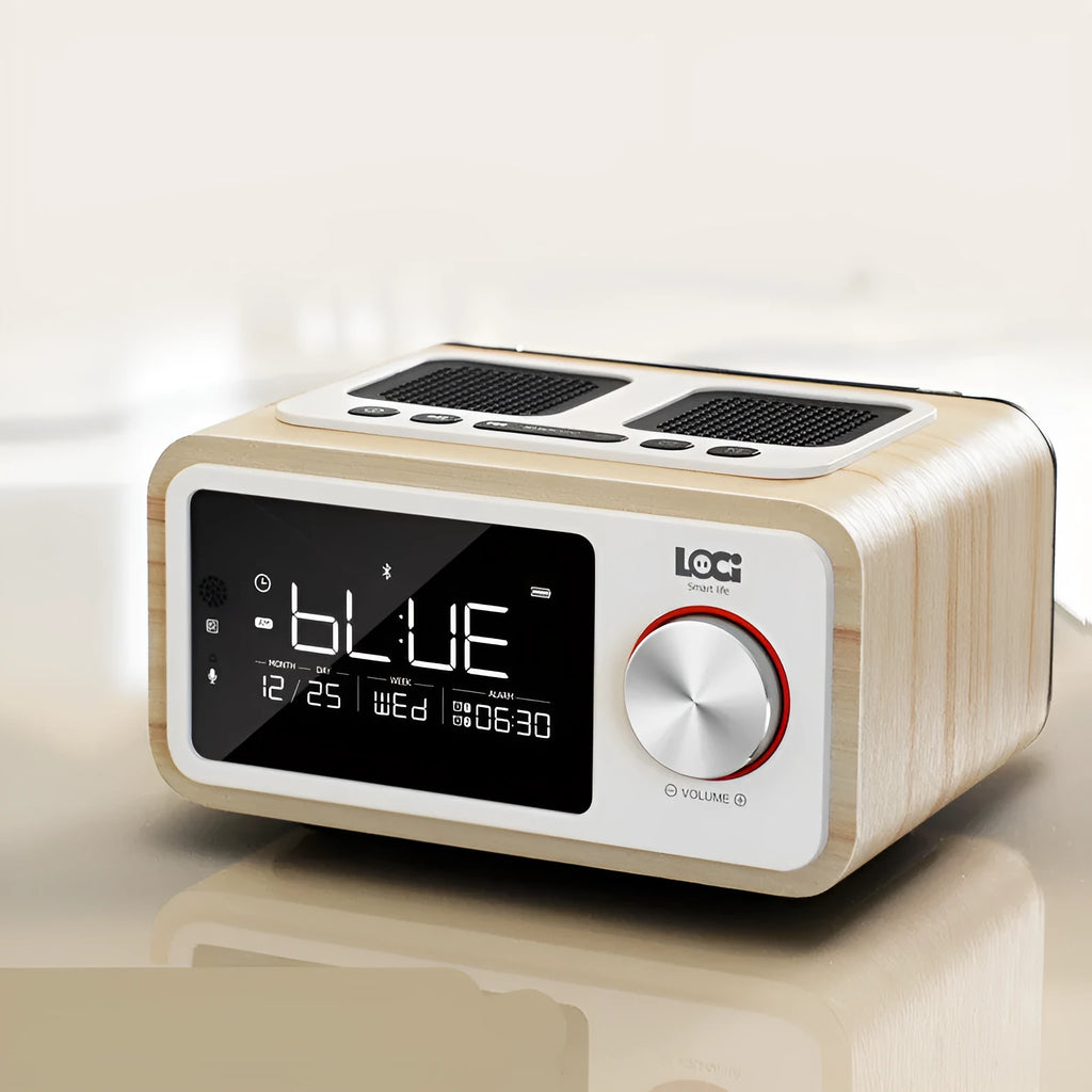 Compact wooden Bluetooth speaker alarm clock radio in golden oil colour on a desk