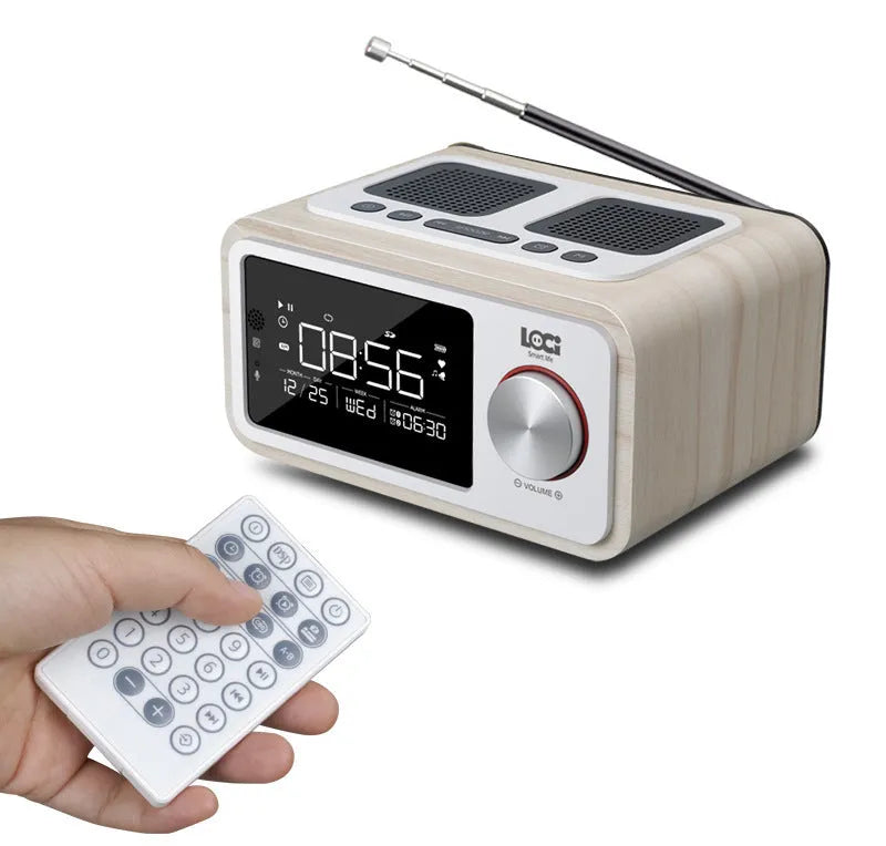 Compact wooden Bluetooth speaker alarm clock radio in golden oil colour on a desk