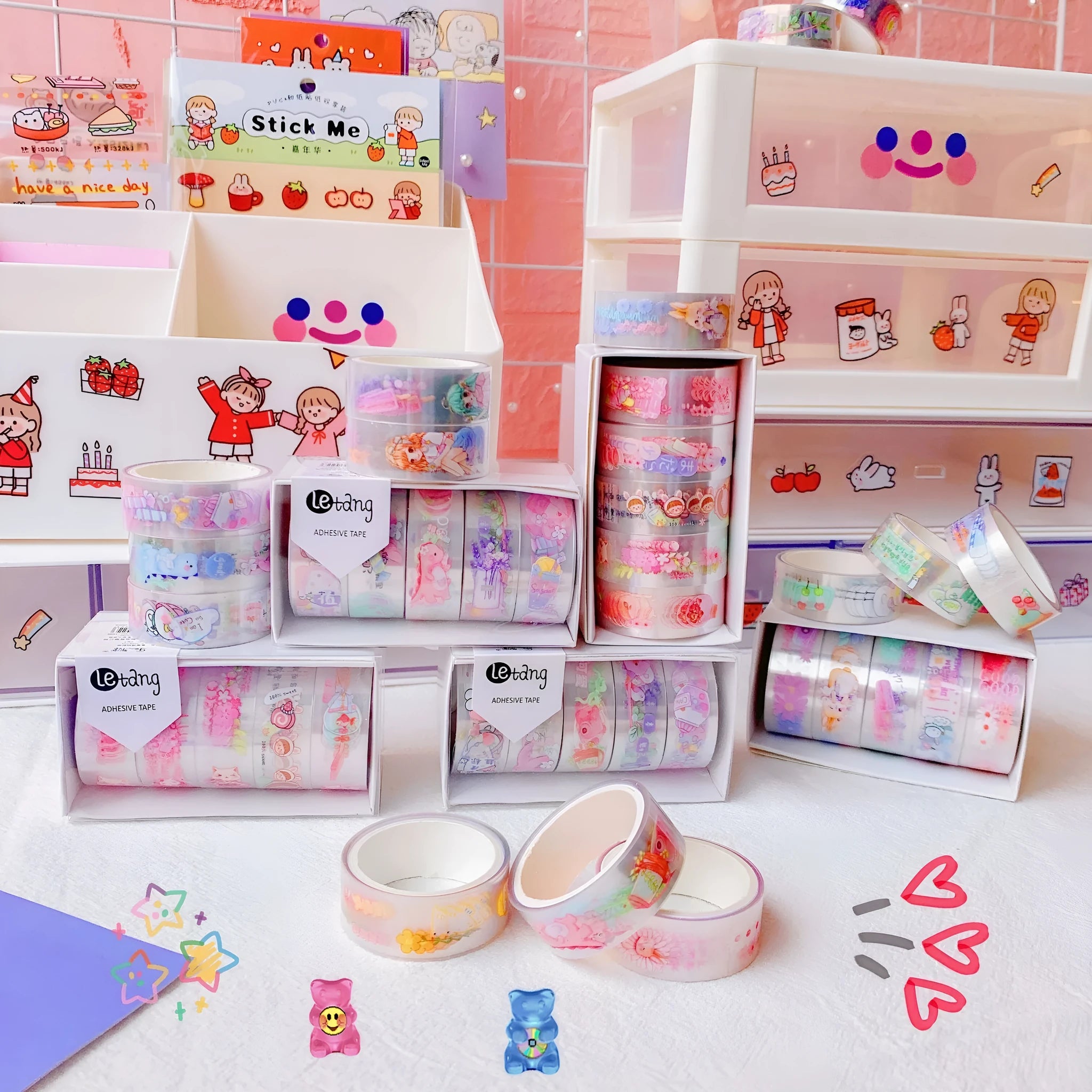 Five rolls of colourful washi paper sticker tape with cartoon designs of dinosaurs, ducks, cats, girls, and rabbits.