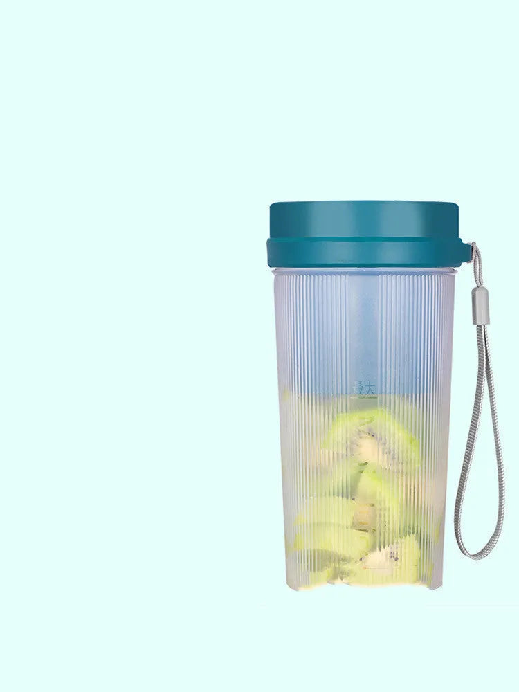 Portable pink or green electric juicer cup with USB charging port and removable lid.