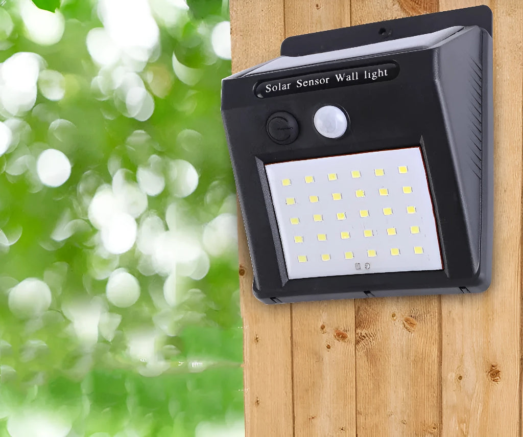 Solar-powered outdoor garden lamp with LED lights and integrated solar panel on a stake.