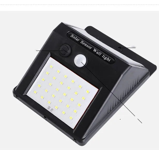 Solar-powered outdoor garden lamp with LED lights and integrated solar panel on a stake.