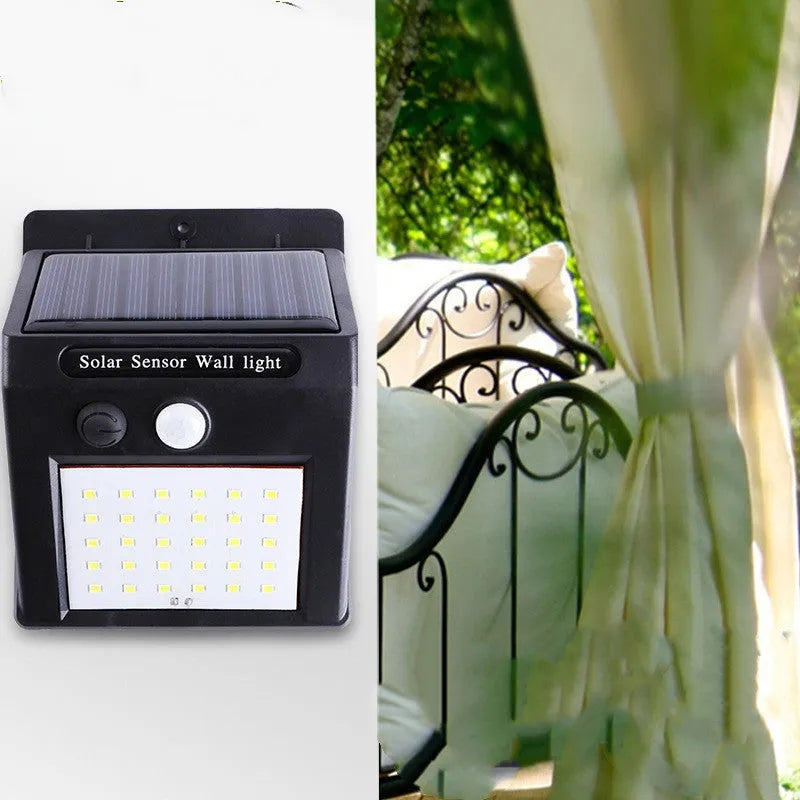 Solar-powered outdoor garden lamp with LED lights and integrated solar panel on a stake.