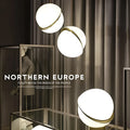 Nordic pendant light with white ball lampshade and golden fixture at adjustable height