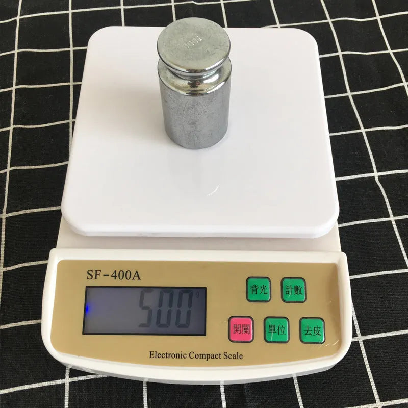SF-400A digital kitchen scale with LCD display on a kitchen worktop.