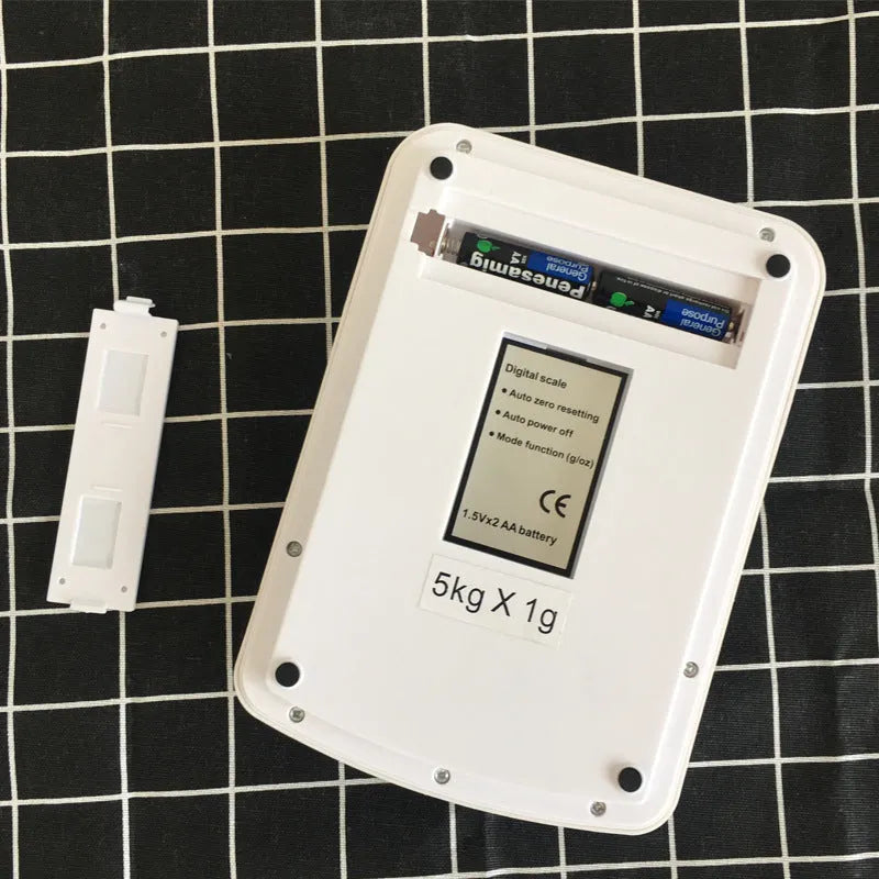 SF-400A digital kitchen scale with LCD display on a kitchen worktop.