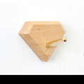 Beech wood adhesive wall hook in brass finish with 10kg capacity and geometric shape options