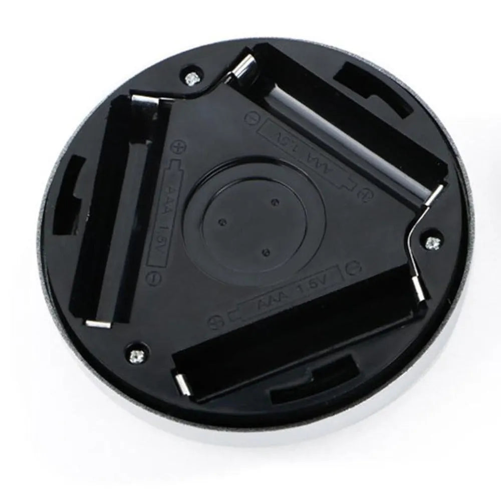 Silver wireless motion sensor night light showing compact 80mm design with LED illumination