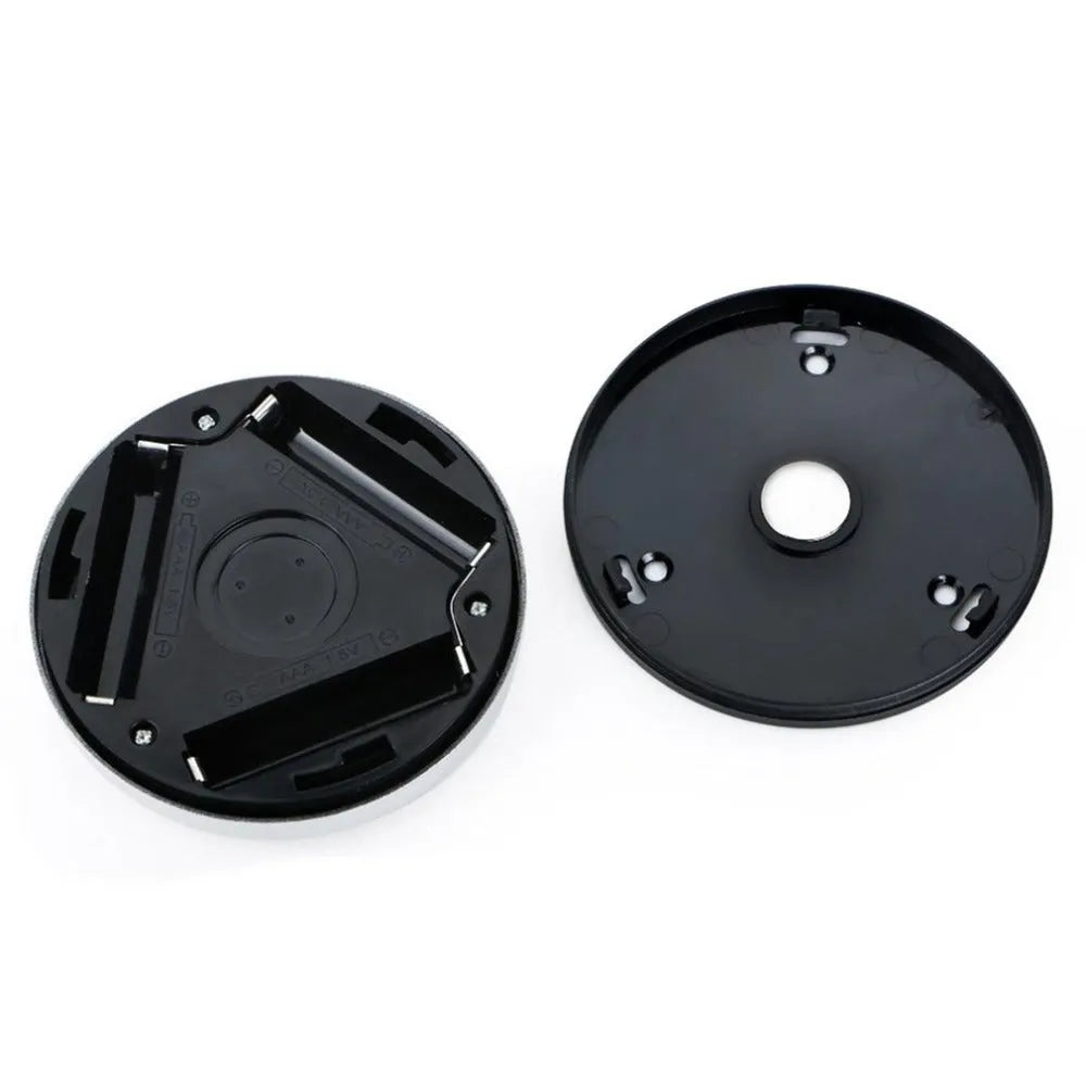 Silver wireless motion sensor night light showing compact 80mm design with LED illumination