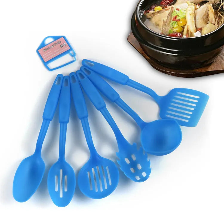 Black rubber and silicone kitchen utensil set with a solid spoon, slotted spoon, and spatula for non-stick pans.