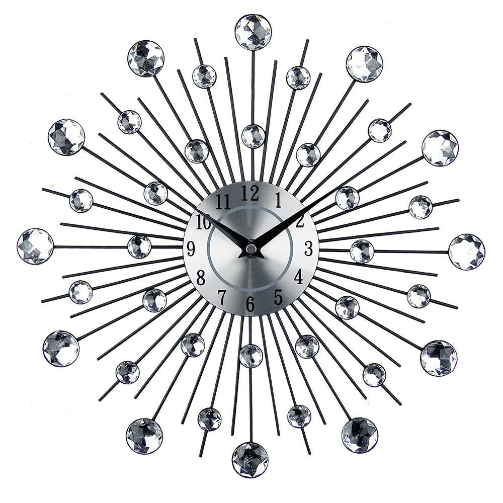Large round silver mute wall clock with metal frame and numbered dial on a wall.