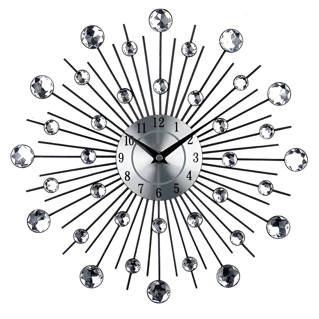 Large round silver mute wall clock with metal frame and numbered dial on a wall.