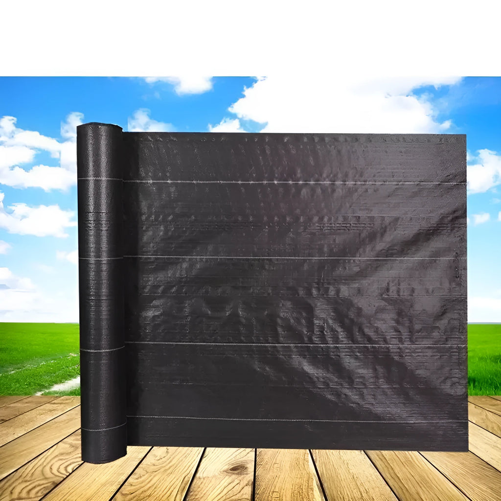 Black polyethylene weed-proof ground cover cloth laid flat on soil, showing woven texture.