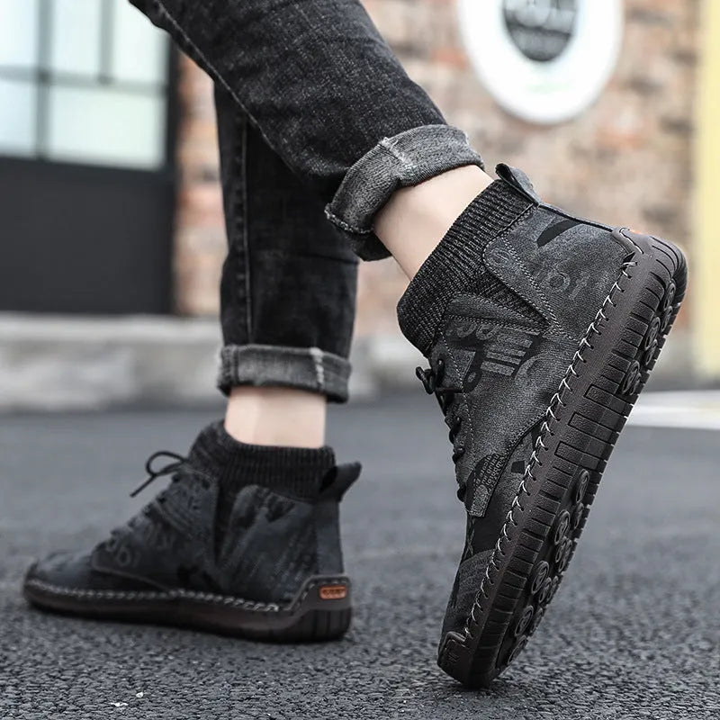 Pair of men's black socks high-top shoes with hand-painted cloth upper and rubber sole for casual winter wear
