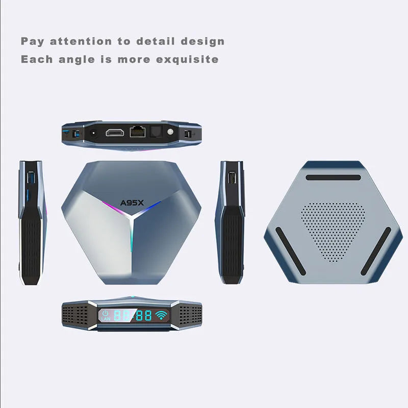 Black 8K Android TV set-top box with remote control and international power plugs on a wooden surface