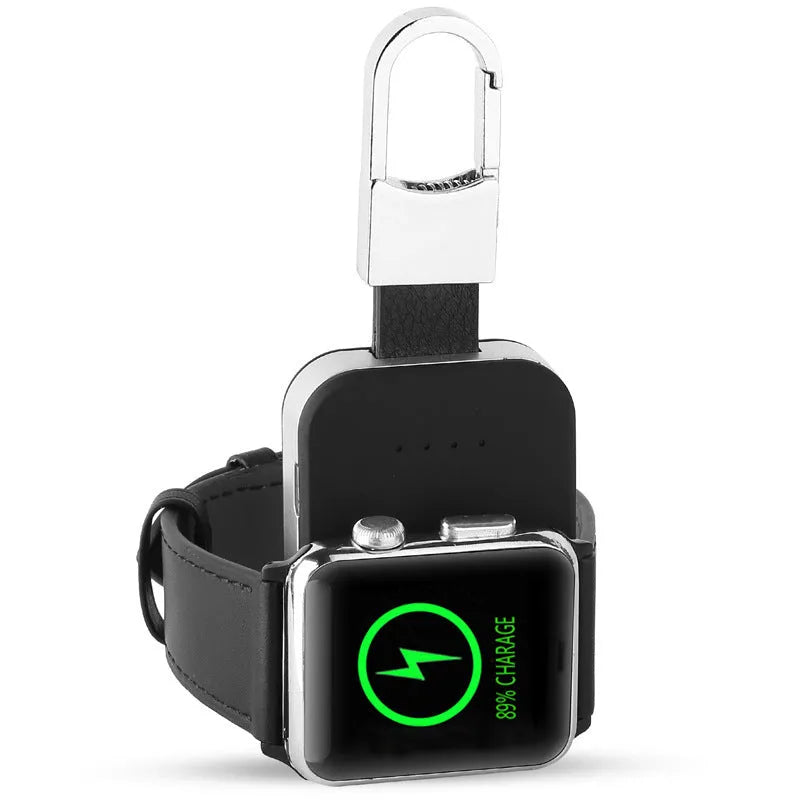 Black keychain-sized wireless power bank for Apple Watch on a keyring.