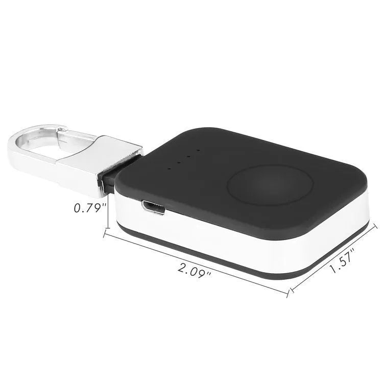 Black keychain-sized wireless power bank for Apple Watch on a keyring.