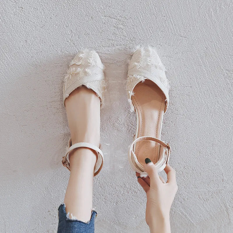 Women's apricot suede ankle strap D'Orsay low-heel flats on a white background.