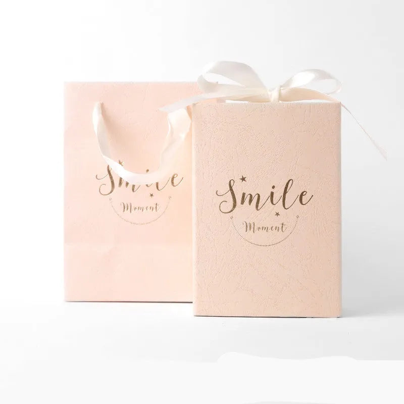 Small cardboard gift box set with matching handbag and raffia detail in blue, pink, red, or white.