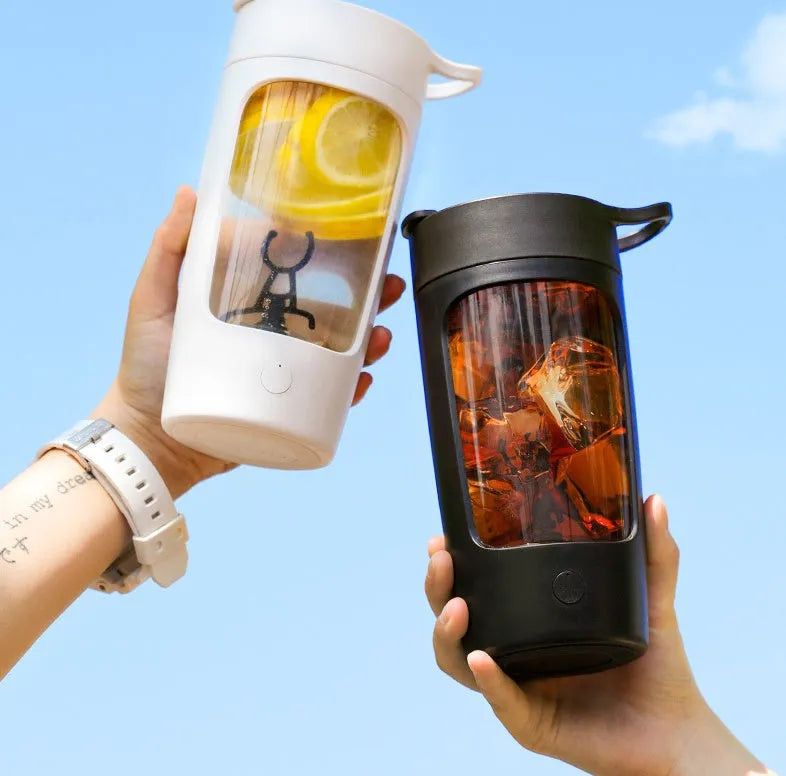 Automatic mixing cup portable juice blender in black, blue, pink, and white colours showing 650ml capacity