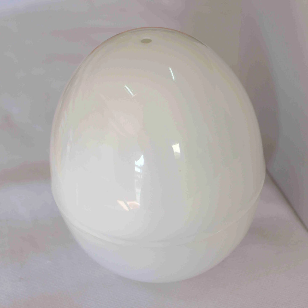 White microwave egg cooker steamer for boiling up to 4 eggs, made from food grade plastic and aluminium.