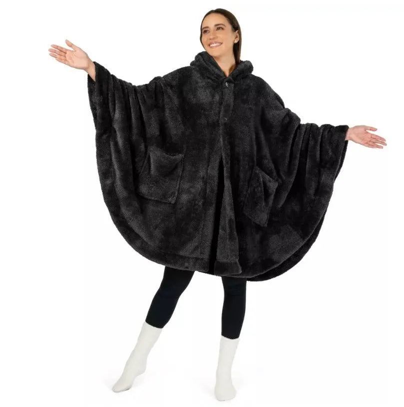 Thick pink hooded bathrobe with long sleeves and cardigan front on a hanger.