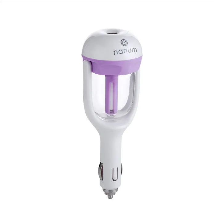 Compact blue portable car humidifier and essential oil diffuser unit on a car dashboard