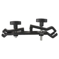 Black ABS plastic umbrella clip attached to an Apple tripod for camera rain protection.