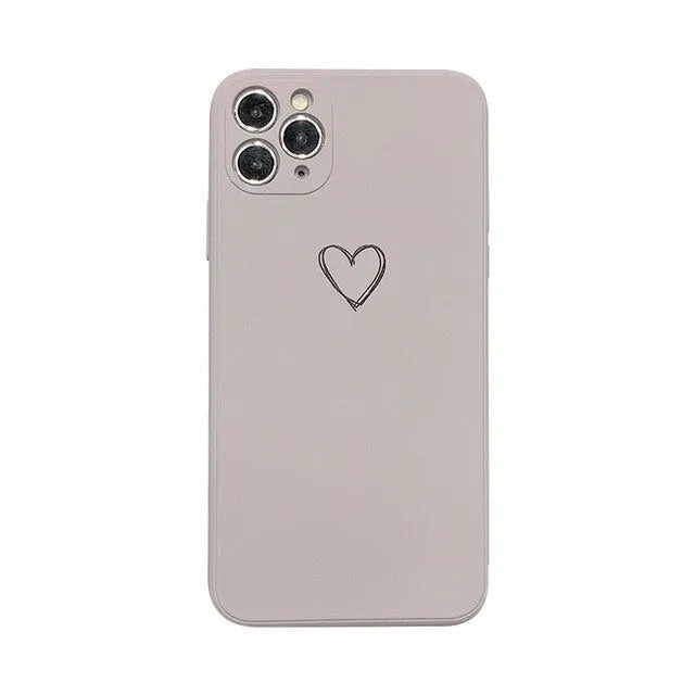 Silicone phone case for Apple iPhone in multiple solid colour options including black, pink, and purple