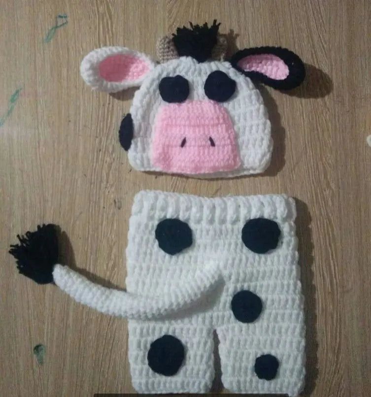 Hand-knitted white newborn cow suit with matching hat and trousers for 0-3 month babies