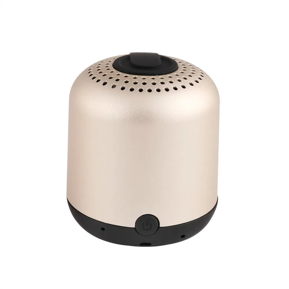 Hieha XQ11 mini cylindrical portable Bluetooth speaker in silver colour on a table