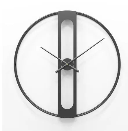 Round metal wall clock with 50 cm diameter in black or gold finish on a wall