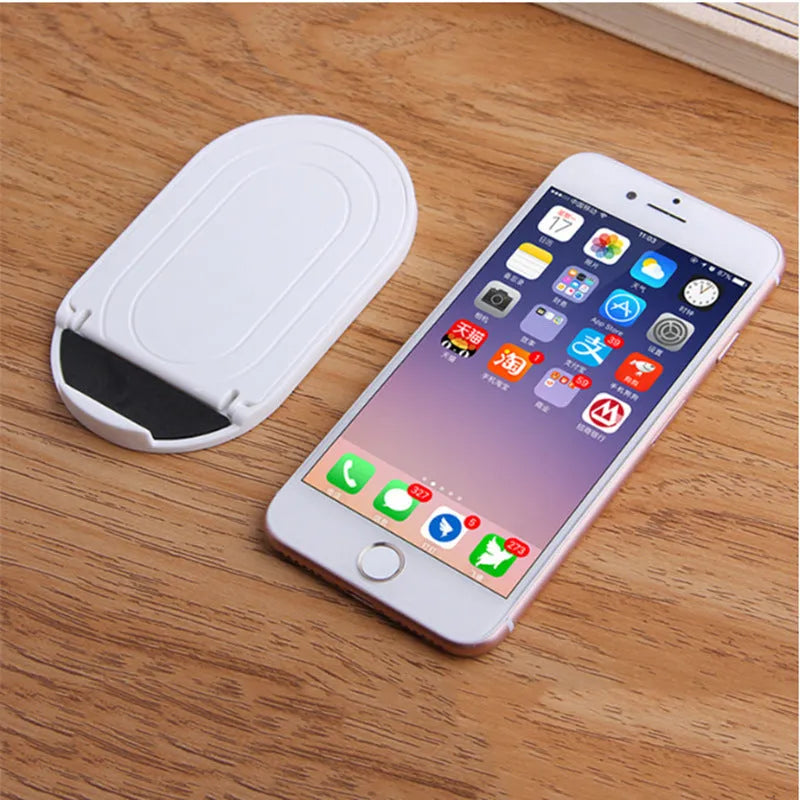 Adjustable plastic lazy bracket mobile phone stand in six colour options on desk