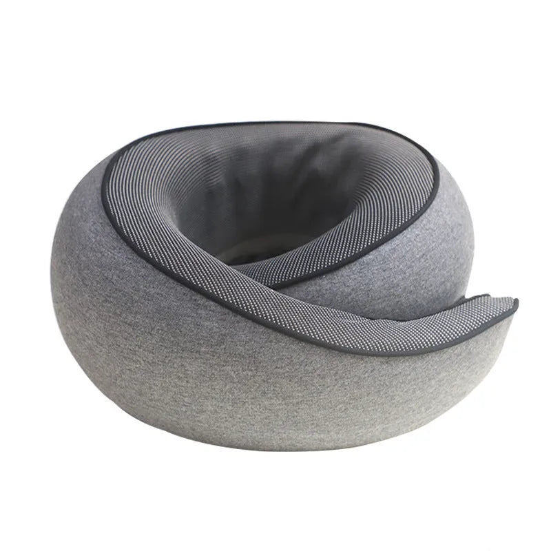Black U-shaped memory foam travel neck pillow with storage bag, shown from the side.