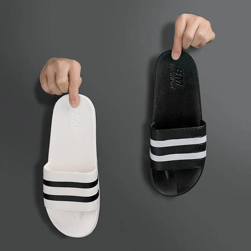 Striped PVC bath slippers in white, black, purple with injection-moulded sole, available in sizes 36-37 to 44-45