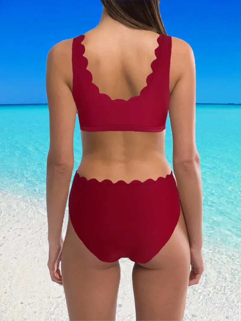 Women's high-waisted split swimsuit in polyester fabric available in red, black and blue colours