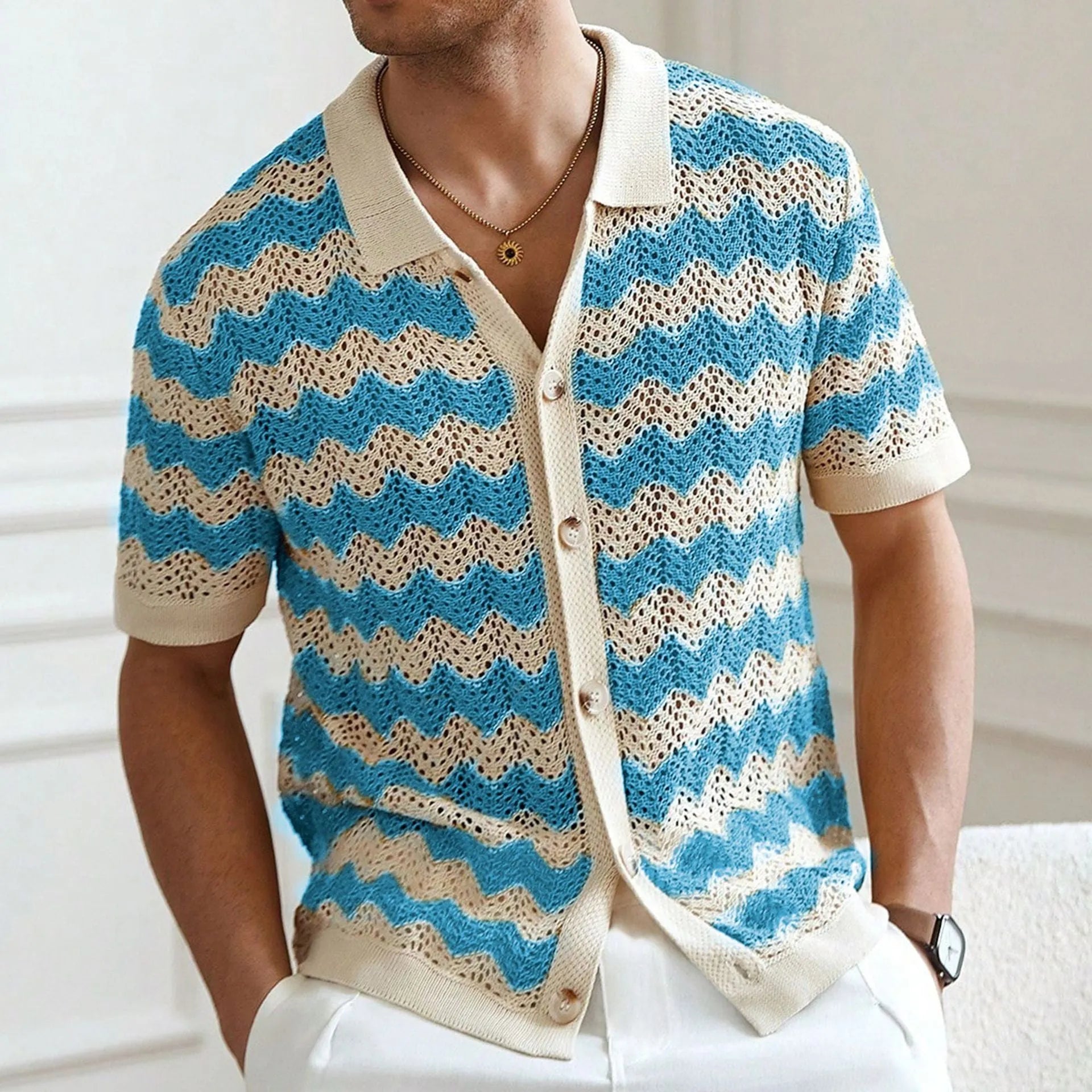 Men's blue short sleeve corrugated sweater with jacquard flocked texture on a hanger.