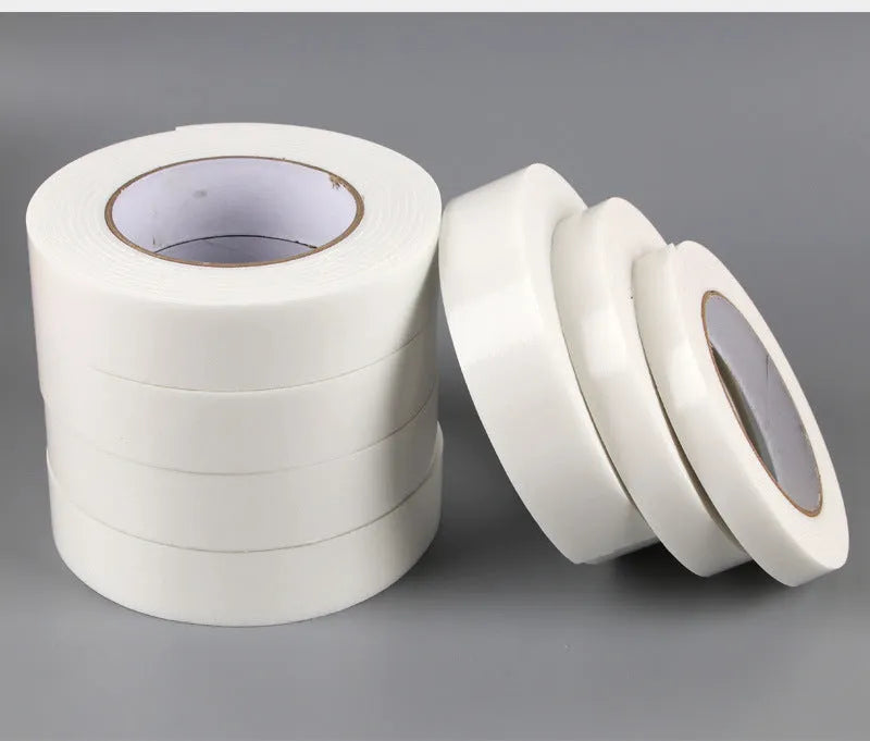 Foam double-sided adhesive tape roll showing 3mm thickness with measurements for 15mm, 18mm, and 30mm width options