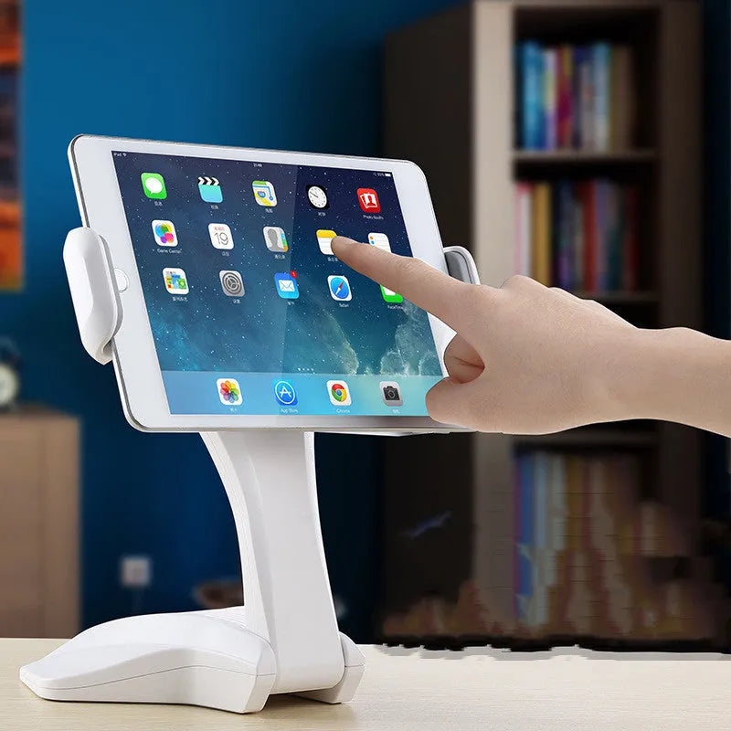 White aluminium tablet stand with adjustable clamp holding a tablet