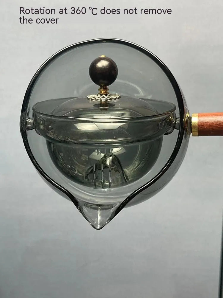 Rotating glass teapot with wooden handle and stainless steel infuser basket