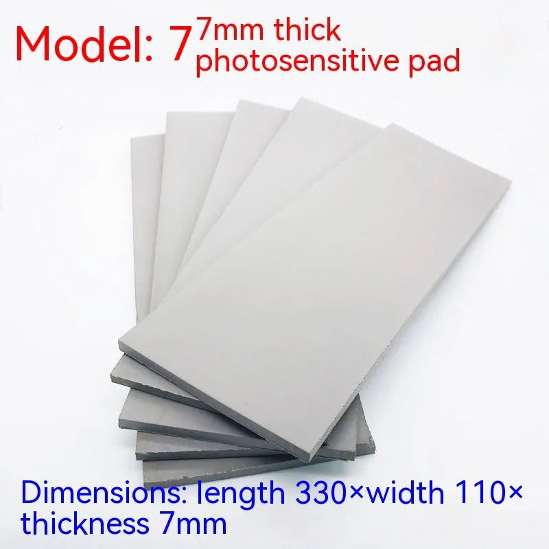 Black and grey plastic light-sensitive seal mat showing 7mm, 4mm, and 2mm thickness options.