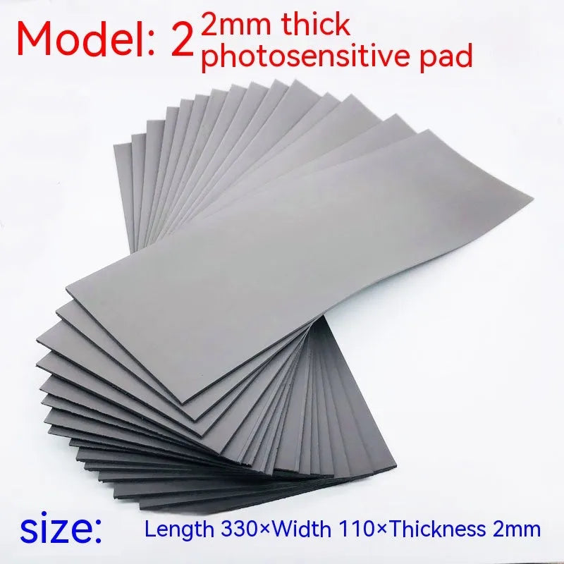 Black and grey plastic light-sensitive seal mat showing 7mm, 4mm, and 2mm thickness options.